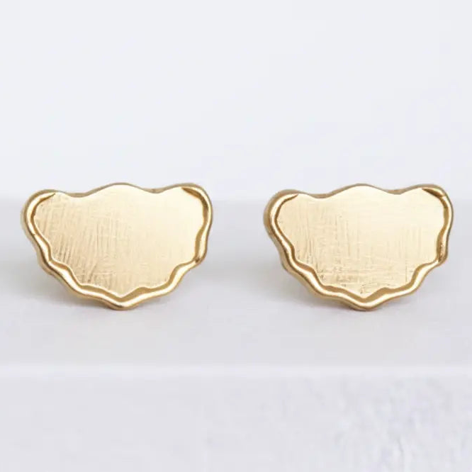 Wavy gold stud earrings, hand carved and made to order by Mary Frances Maker