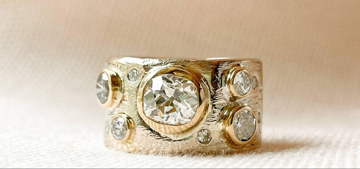 “Custom 14k gold scatter cigar band ring with heirloom diamonds