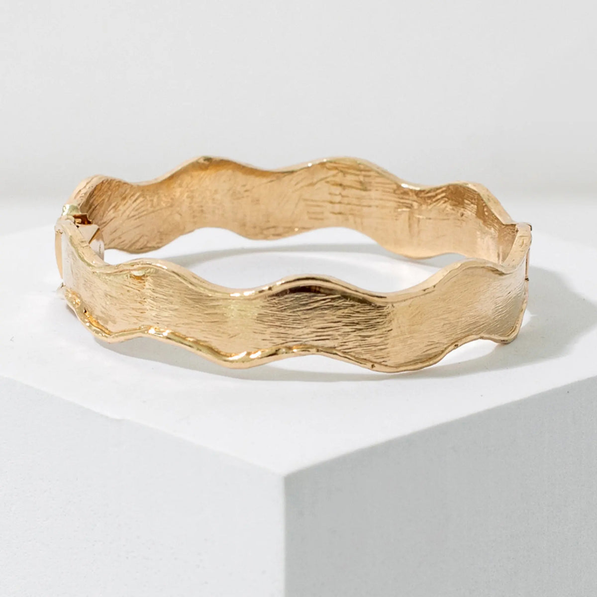 Wavy gold bangle bracelet, hand carved and made to order by Mary Frances Maker